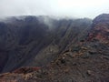 Dramatic landscape : Dolomieu crater in cloudy weather, piton de