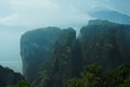 Dramatic landscape of Meteora monastery in morning fog. Royalty Free Stock Photo