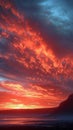 Dramatic landscape mountains highlighted under a sky ablaze in red Royalty Free Stock Photo