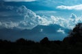 Dramatic landscape of peak mountains with clouds and sunlight. Royalty Free Stock Photo