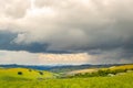 Dramatic landscape, rolling hills under thunderstorm clouds in Nyika National Park in Malawi, Africa