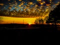 Dramatic late sunset with tress and highway