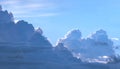 Dramatic light and dark cumulonimbus and cumulus clouds in blue sky background