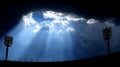 Dramatic Light Rays Break Through Storm Clouds Over Stadium Lights Royalty Free Stock Photo