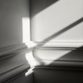 Dramatic Light and Shadow Play on Interior Walls and Baseboards Royalty Free Stock Photo