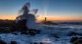 Dramatic Lighthouse at Sunset with Crashing Waves on Rocky Coastline Royalty Free Stock Photo