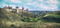 Storm clouds gather around Medieval gothic castle on the hill. Panoramic view Royalty Free Stock Photo