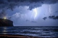 Dramatic lightning over sea at night Royalty Free Stock Photo