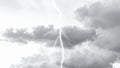 Dramatic lightning strike illuminating dark, stormy clouds in monochrome Royalty Free Stock Photo