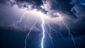 Dramatic lightning strike illuminating dark, stormy clouds in the sky. Royalty Free Stock Photo