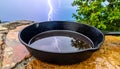Dramatic Lightning Strike Reflected in a WaterFilled Pan Royalty Free Stock Photo