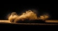 Dust cloud explosion in dark environment with illuminated particles and ground dirt Royalty Free Stock Photo