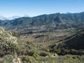 Dramatic lush green picturesque valley with old village Las Portelas. Landscape with sharp rock formation, hills and