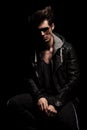 Dramatic man in leather clothes with weird hairstyle Royalty Free Stock Photo