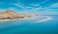 Dramatic mid level aspect aerial panoramic view of the beautiful beach, lagoon and sand dunes at Sotavento on Fuerteventura Royalty Free Stock Photo