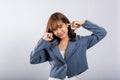 Dramatic moment when an Asian woman covers her ears with her palms and closes Royalty Free Stock Photo