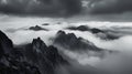 Jagged Mountain Peaks Emerging from Clouds nature landscape Royalty Free Stock Photo