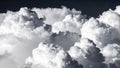 Dramatic monochrome clouds filling the frame against a dark sky, fluffy formations. Royalty Free Stock Photo