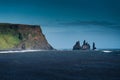 Dramatic moody famous Reynisdrangar rock formation and black Reynisfjara Beach at coastline of Atlantic ocean in Vik, Iceland Royalty Free Stock Photo