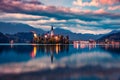 Dramatic morning view of Pilgrimage Church of the Assumption of Maria. Calm autumn sunrise on Bled lake, Julian Alps, Slovenia, Eu Royalty Free Stock Photo