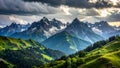 Dramatic mountain landscape with green hills, snow capped peaks, and cloudy sky Royalty Free Stock Photo