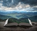 Dramatic mountain valley on a book