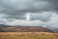 Dramatic mountain valley under a cloudy sky with a rugged landscape Royalty Free Stock Photo