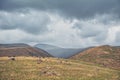 Dramatic mountain valley under a cloudy sky with a rugged landscape Royalty Free Stock Photo