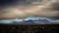 Dramatic Mountains Just Up from the Valley under Thick Clouds