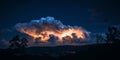 Dramatic Night Sky with a Lightning-Illuminated Cloud Royalty Free Stock Photo