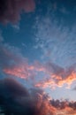 dramatic night sky, with moon and sun bathing the clouds with light, long exposure shot, orange and blue colors, mexico