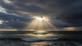 Dramatic Ocean Sunset with Sun Rays Breaking Through Dark Clouds Royalty Free Stock Photo