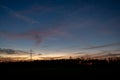 Dramatic orange and blue cloud and sky after storm and raining over agricultural field Royalty Free Stock Photo