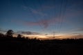 Dramatic orange and blue cloud and sky after storm and raining over agricultural field Royalty Free Stock Photo