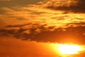 Dramatic orange, yellow clouds and sun, sunset Royalty Free Stock Photo