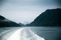 A dramatic, overcast scenery on the coeast of fjord during a ferry ride in Norway near Bergen.