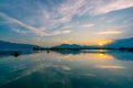 Dramatic panorama evening sky and clouds over mountain and lake at sunset