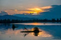 Dramatic panorama evening sky and clouds over mountain and lake at sunset