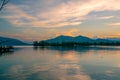 Dramatic panorama evening sky and clouds over mountain and lake at sunset