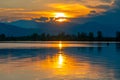 Dramatic panorama evening sky and clouds over mountain and lake at sunset