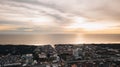 A dramatic panoramic aerial view of Sekinchan fishing town at golden sunset time