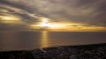 A dramatic panoramic aerial view of Sekinchan fishing town at golden sunset time