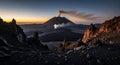 Volcanic Landscape at Sunrise: Active Volcano Emitting Smoke Royalty Free Stock Photo