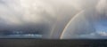 Dramatic Panoramic View of a cloudscape with Rainbow Royalty Free Stock Photo