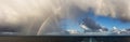 Dramatic Panoramic View of a cloudscape with Rainbow Royalty Free Stock Photo