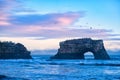 Dramatic pink twilight over Natural Bridges State Beach, Santa Cruz, California, USA. Amazing landscape with natural stone rock Royalty Free Stock Photo