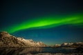 Dramatic polar lights, Aurora borealis over the mountains in the North of Europe - Lofoten islands, Nature of Norway Royalty Free Stock Photo