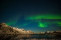 Dramatic polar lights, Aurora borealis over the mountains in the North of Europe - Lofoten islands, Norway Royalty Free Stock Photo