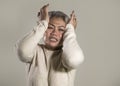 Dramatic portrait of attractive sad and depressed middle aged Asian woman crying helpless suffering depression problem and anxiety Royalty Free Stock Photo