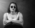 Dramatic portrait of beautiful Pacific Islander woman wearing sunglasses